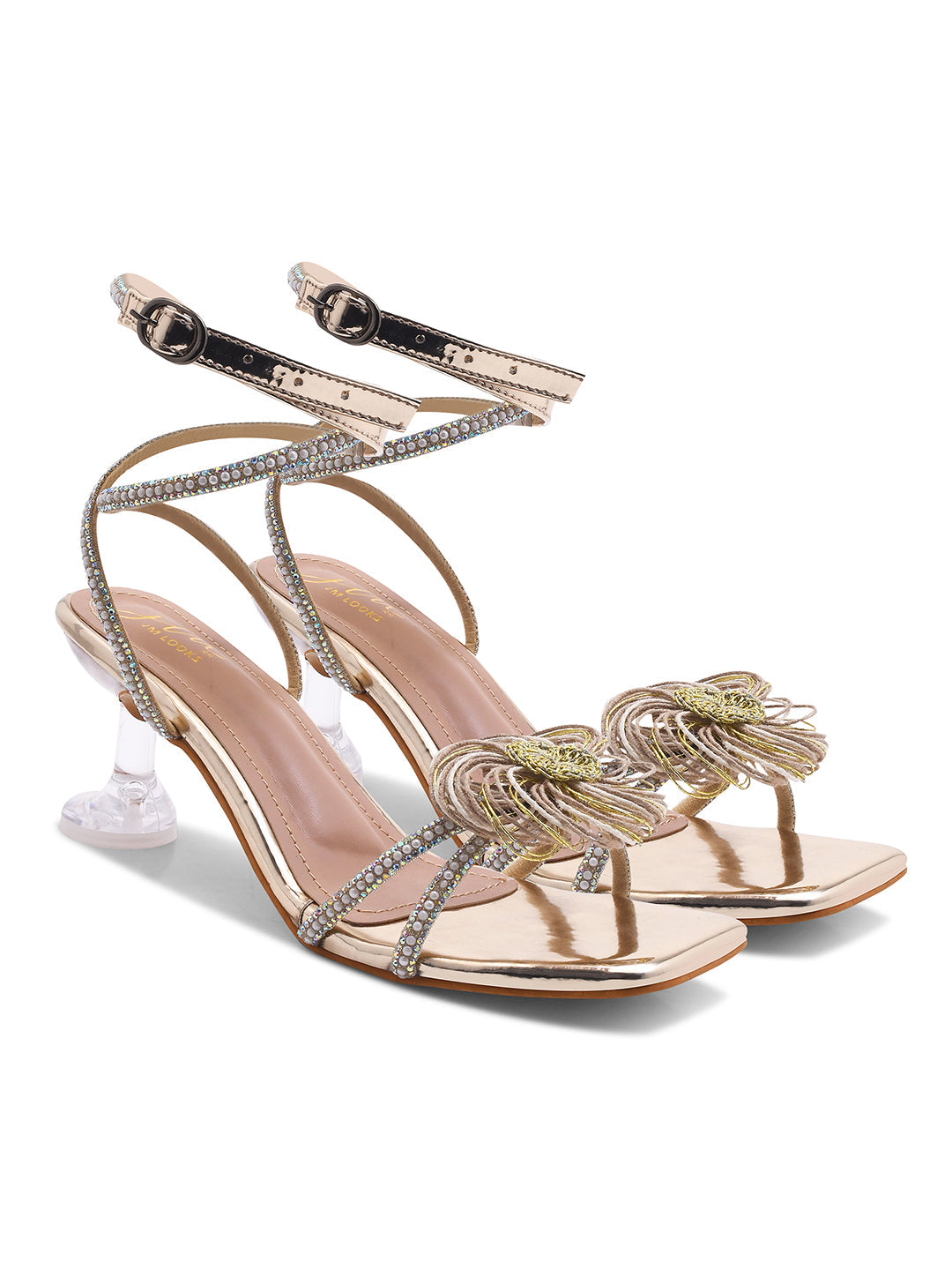Jm Looks stiletto heels with a floral embellishment on the front and shimmering ankle-wrap straps
Golden