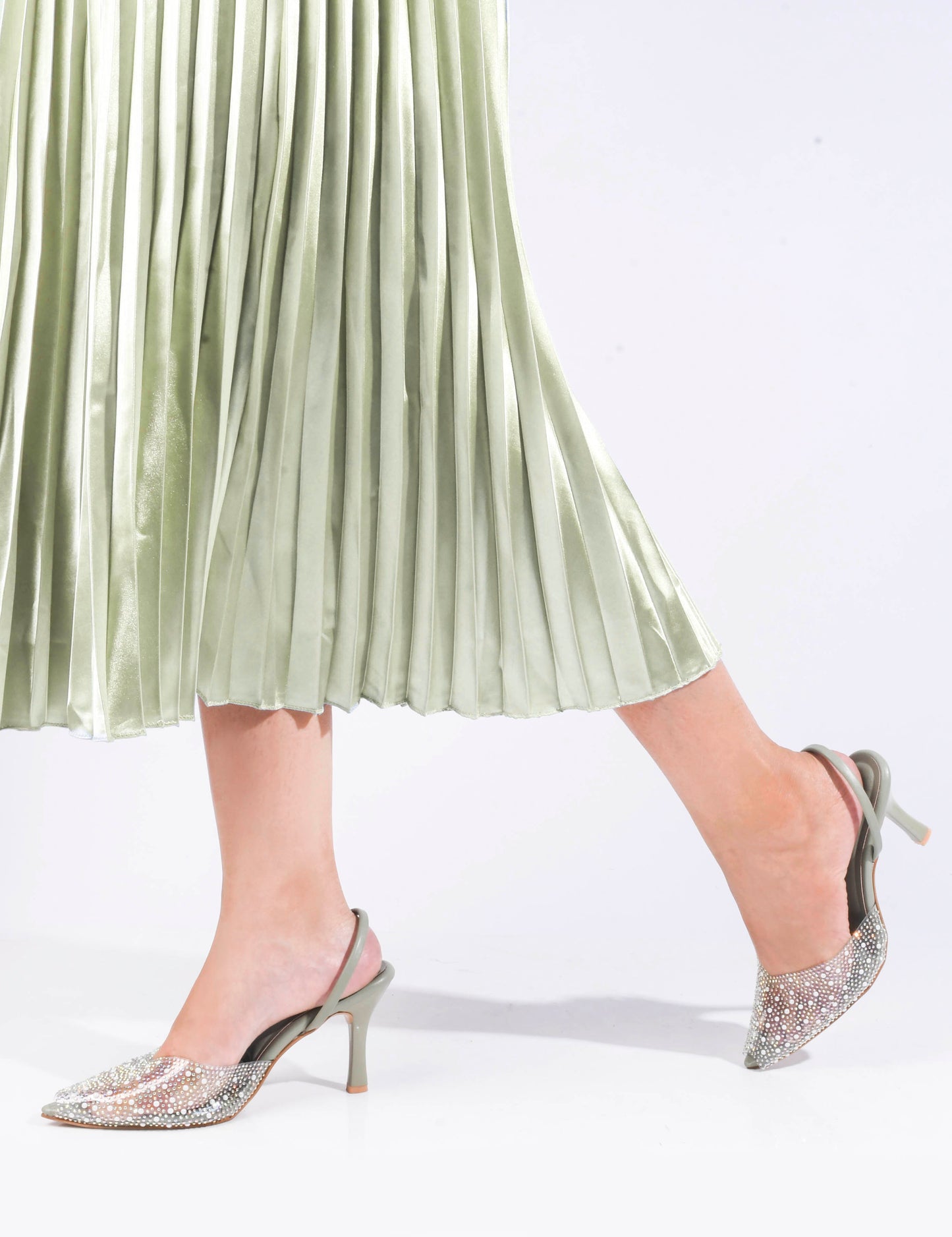 pointed toe slingback heels adorned with sparkling embellishments
Green