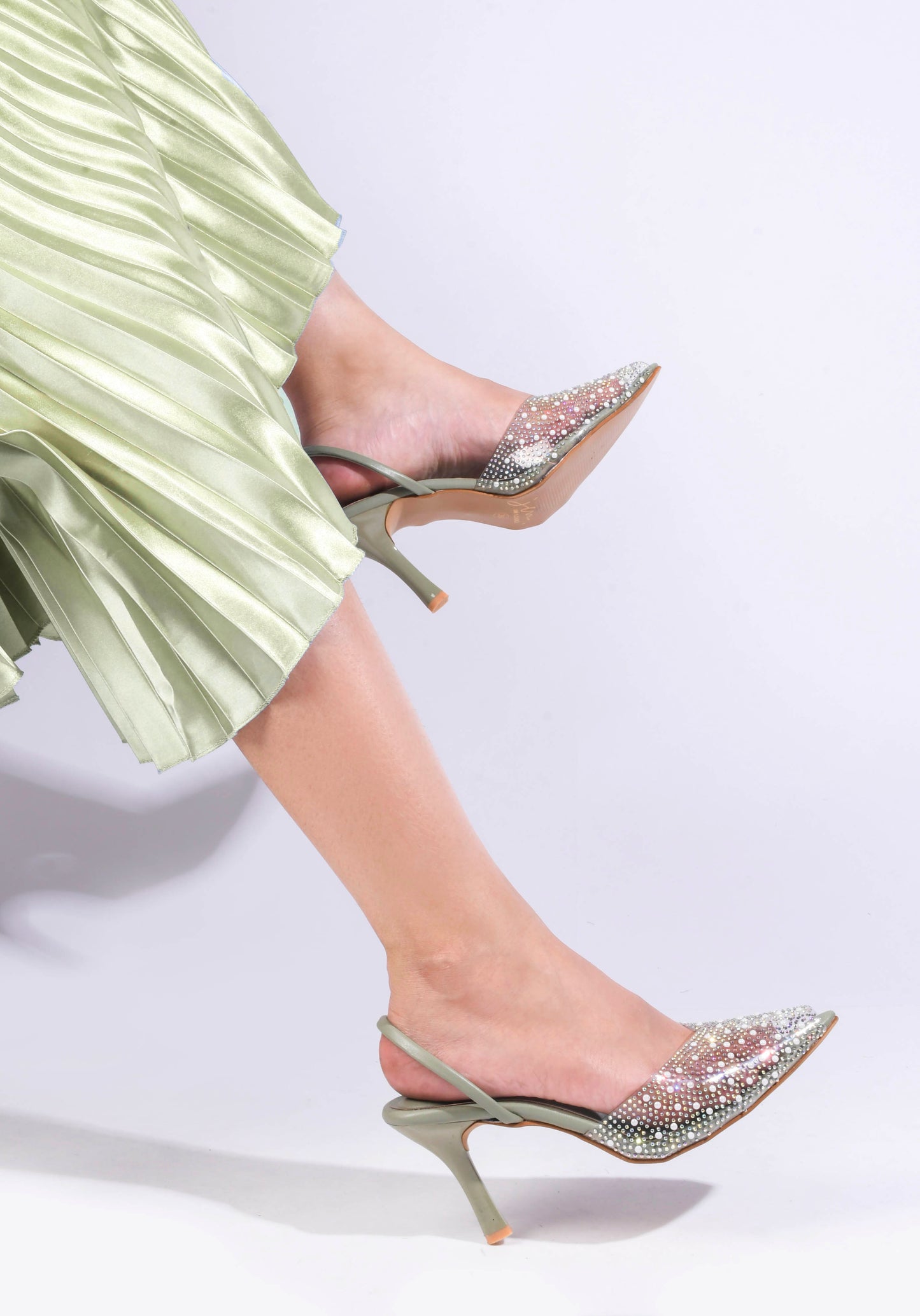 pointed toe slingback heels adorned with sparkling embellishments
Green