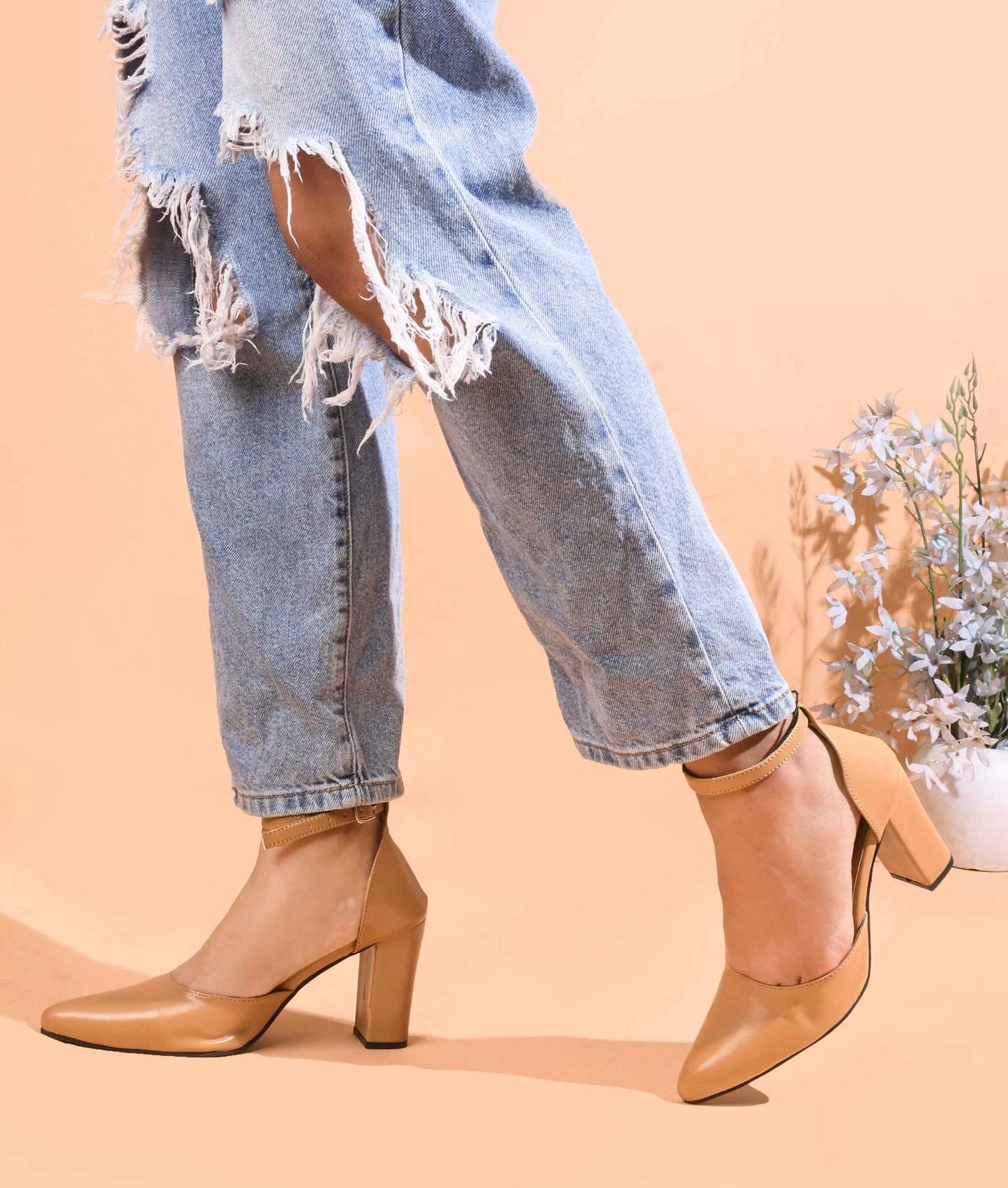 pointed toe block heel pumps with an ankle strap
Beige