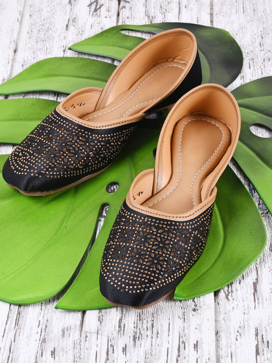 laser-cut juttis with intricate patterns on the vamp
 Black