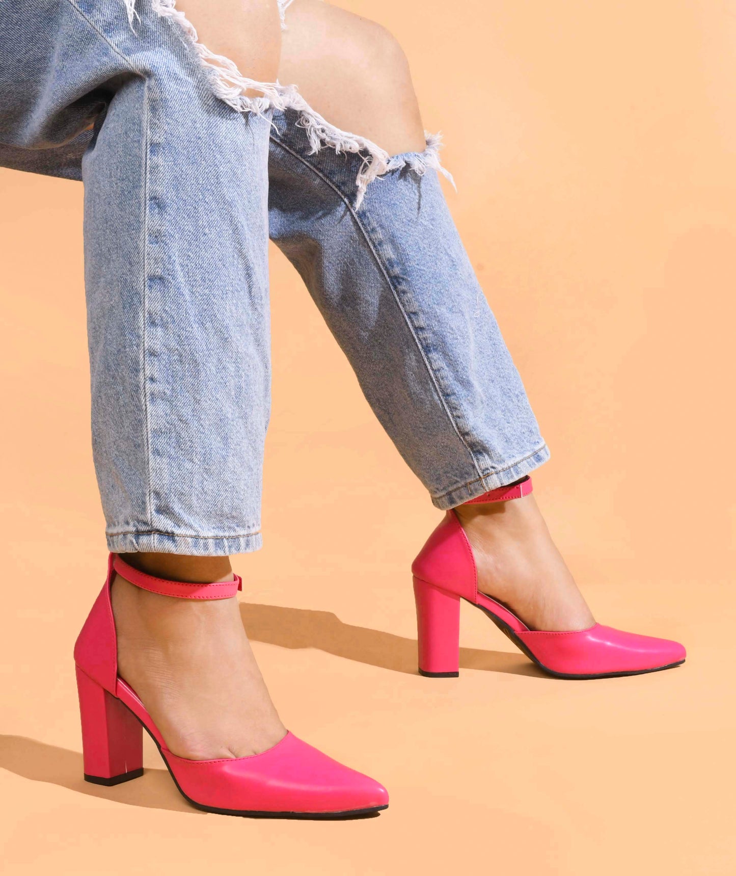 pointed toe block heel pumps with an ankle strap
Rani