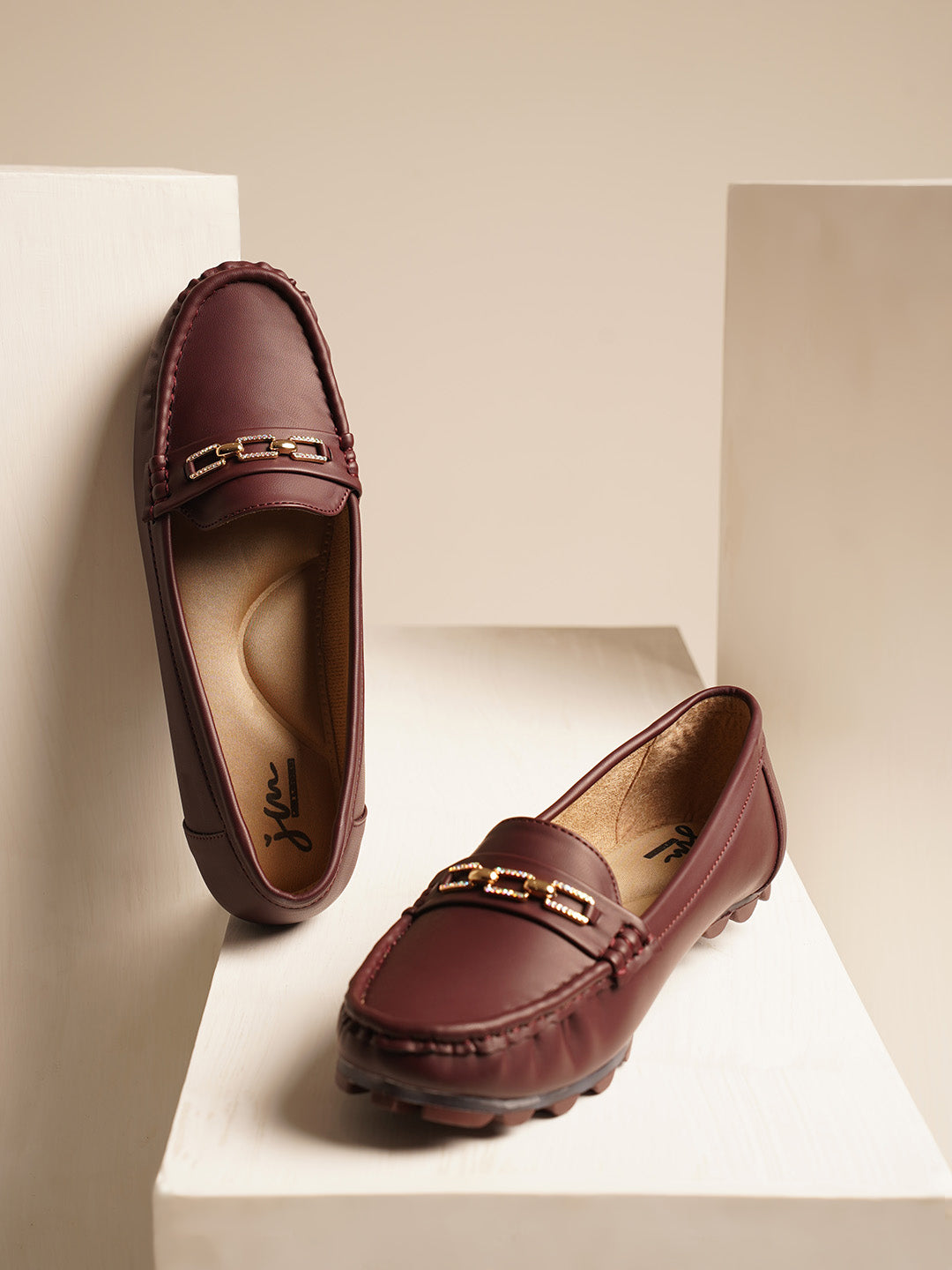 casual loafers with a metal bit embellishment on the vamp and a textured sole
Cherry