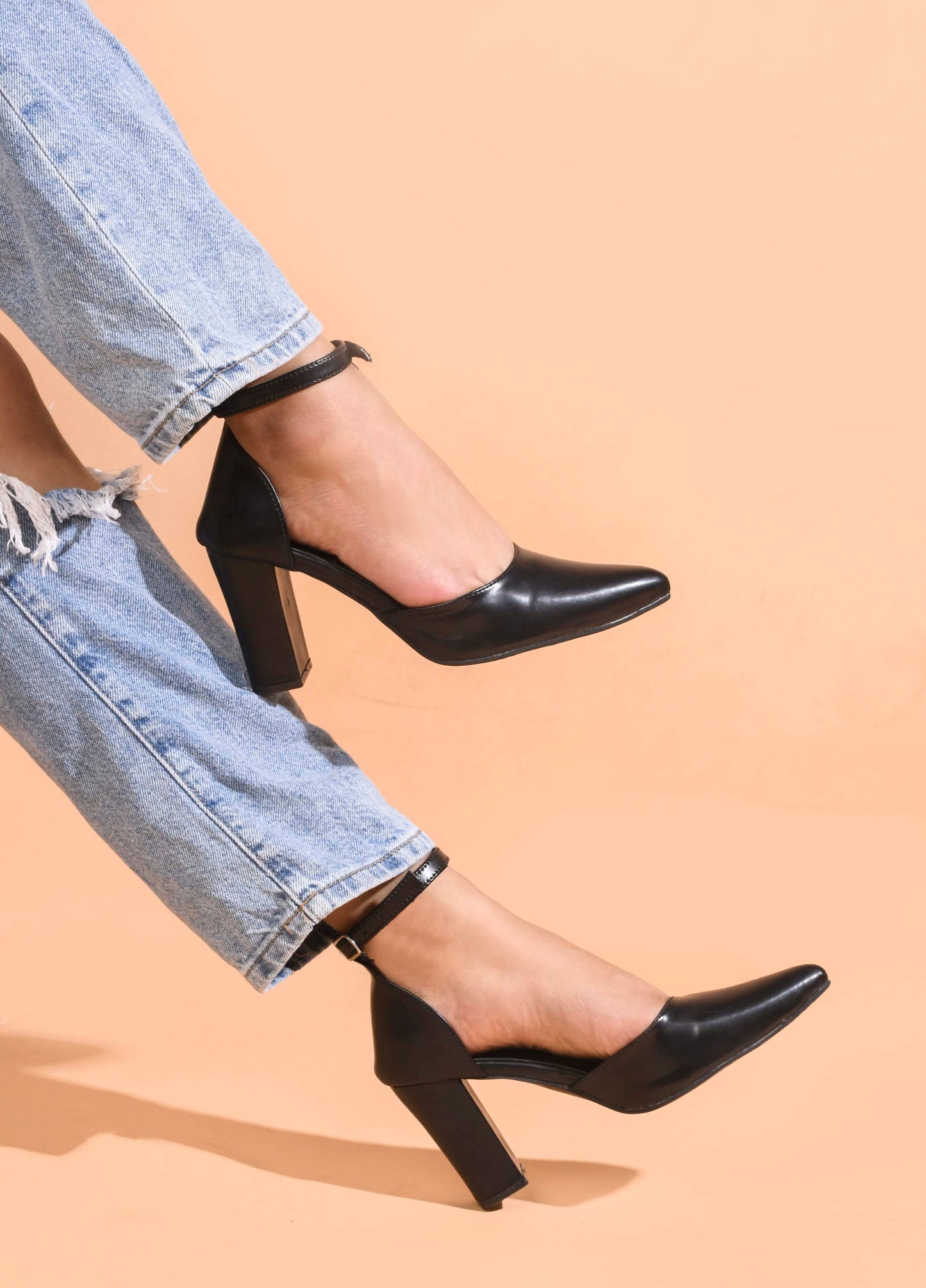 pointed toe block heel pumps with an ankle strap
Black