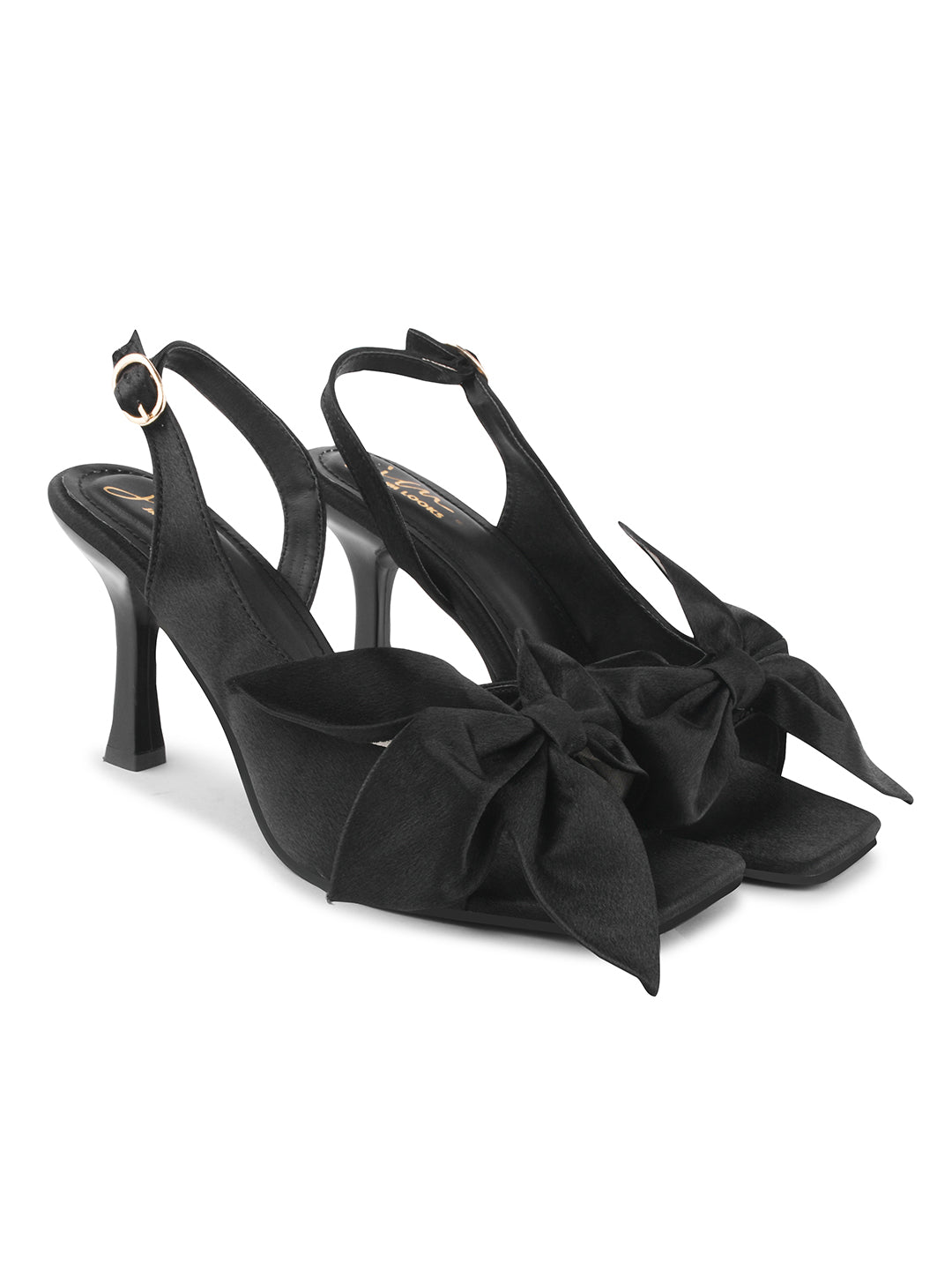 elegant heels featuring a large bow detail on the front and an ankle strap
Black