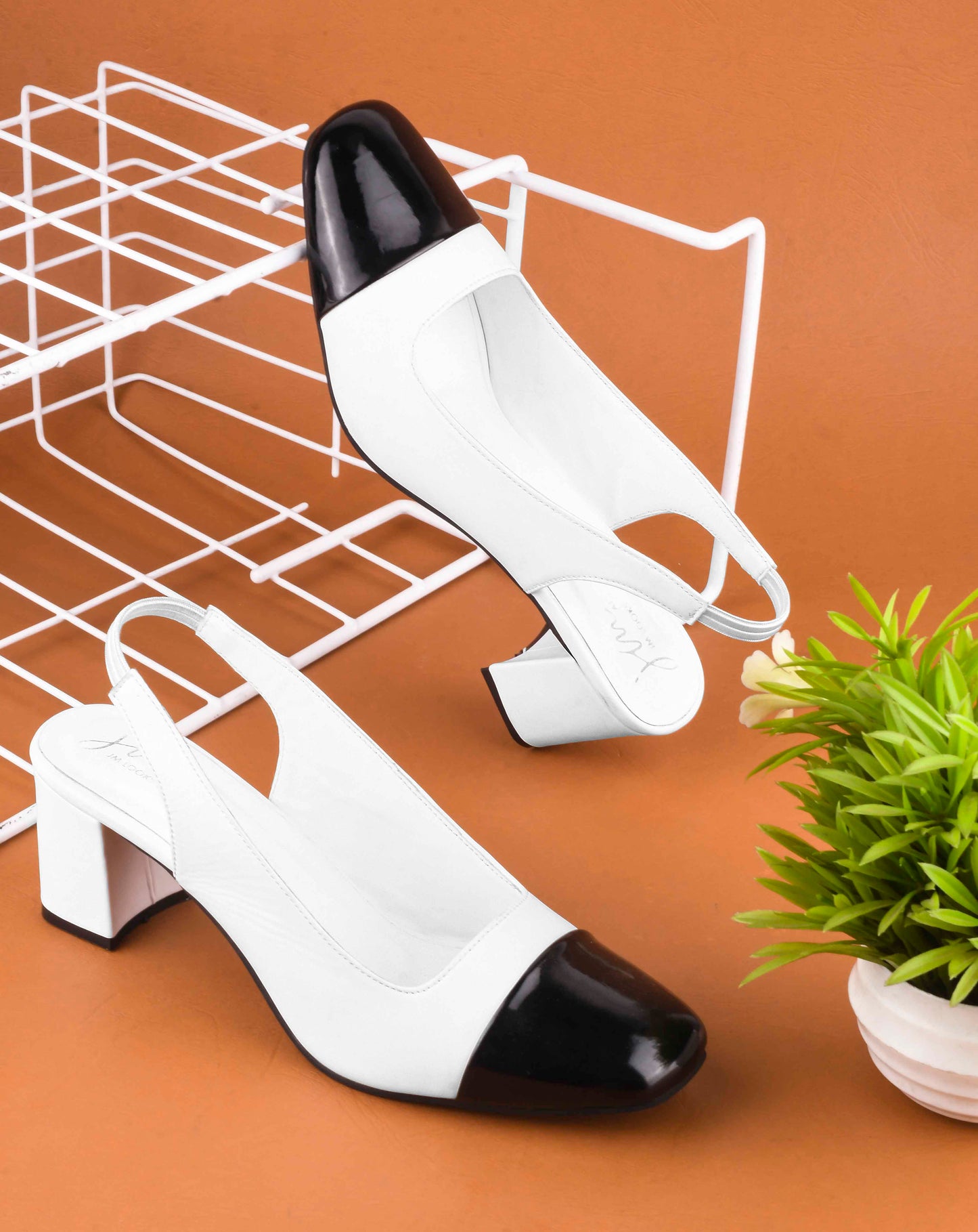 women's two-tone slingback block heels with a contrasting cap toe
B&W
