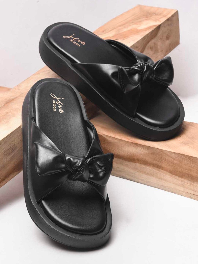 JM Looks women's platform slides with a large bow detail on the strap
Black