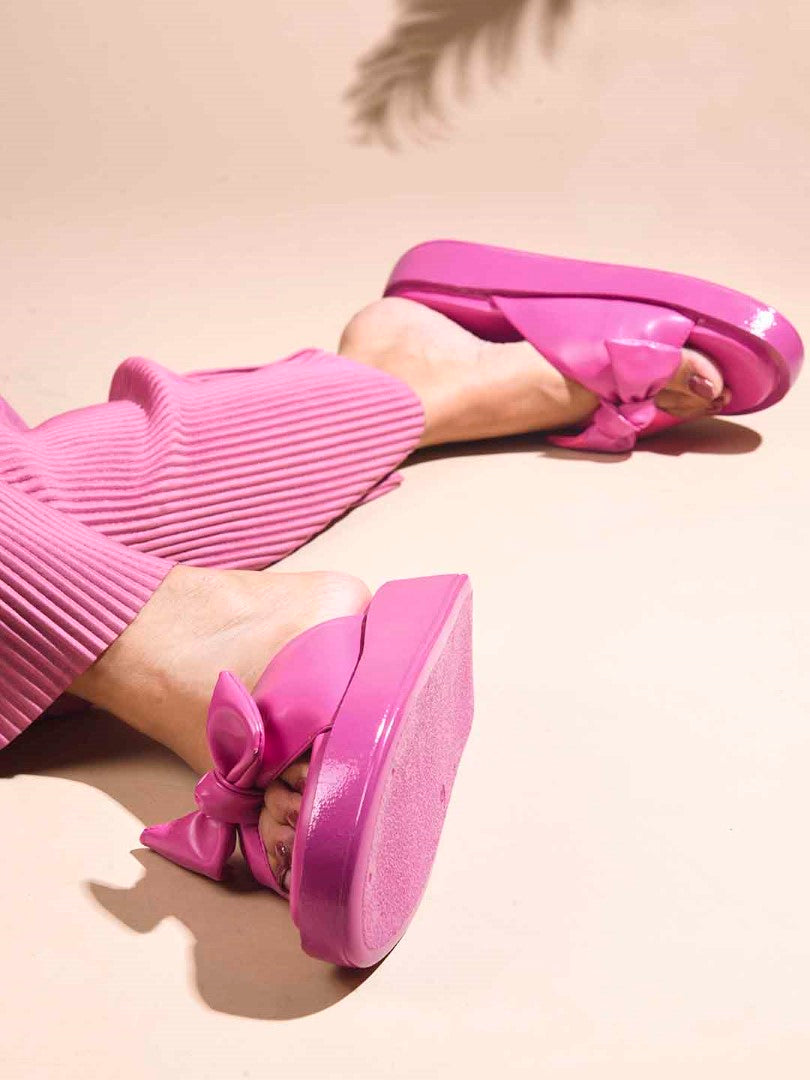 JM Looks women's platform slides with a large bow detail on the strap
Pink