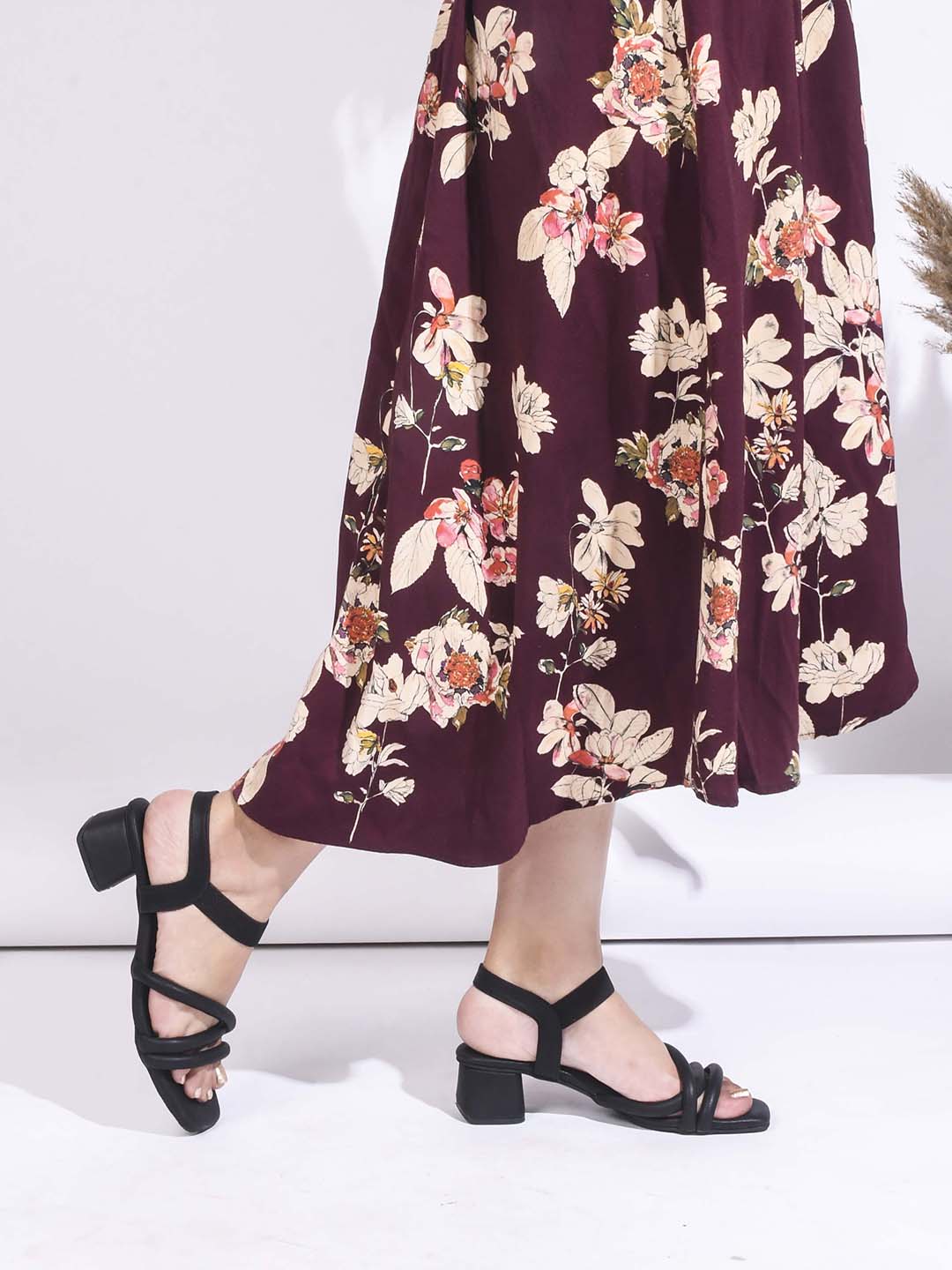 block heel sandals featuring padded, intertwined straps and an adjustable ankle strap
Black