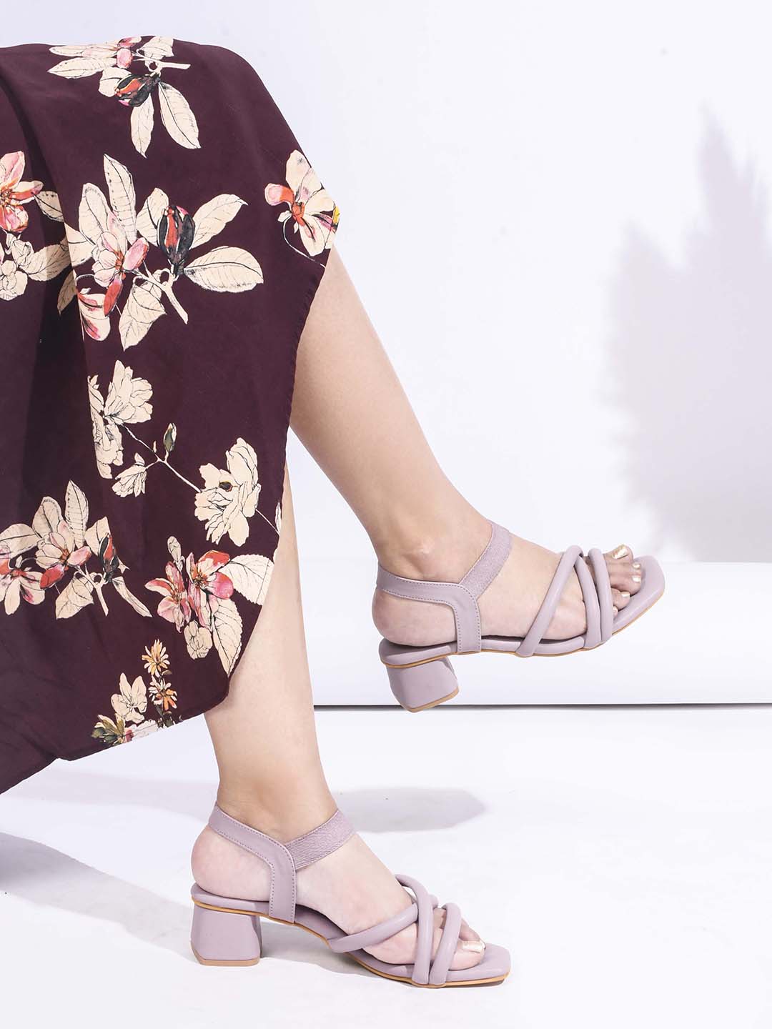 block heel sandals featuring padded, intertwined straps and an adjustable ankle strap
Lavender