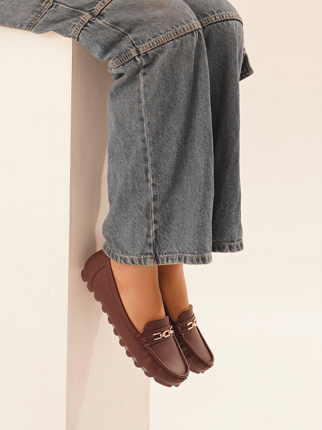 casual loafers with a metal bit embellishment on the vamp and a textured sole
Cherry