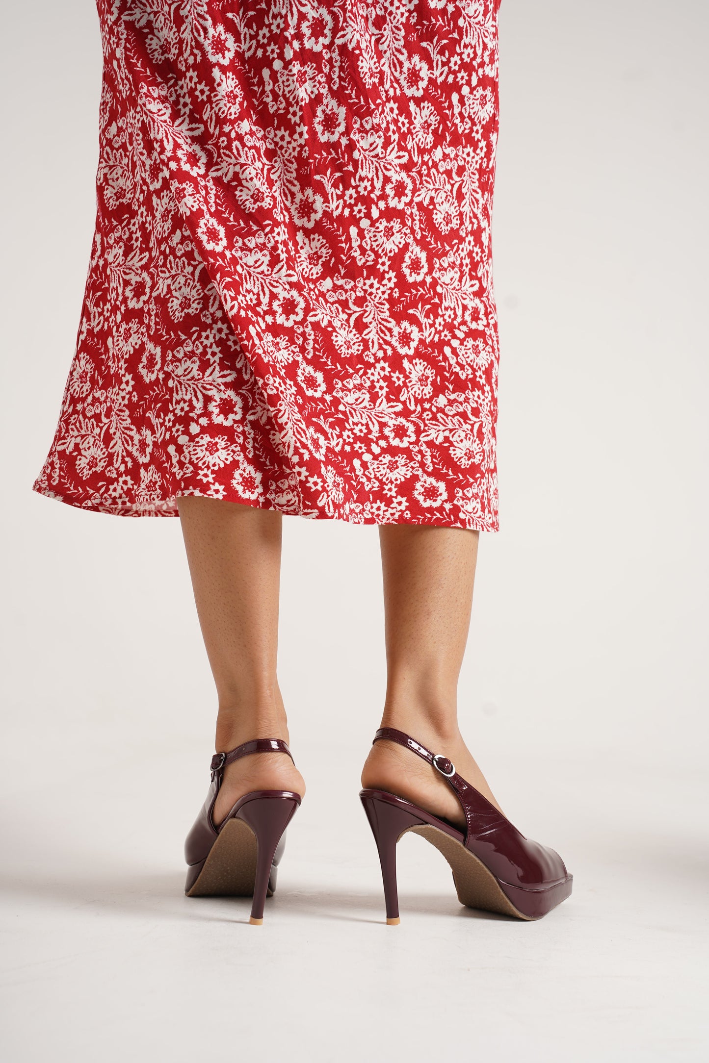 Jm Looks black patent slingback heels with a high stiletto heel and platform
Cherry