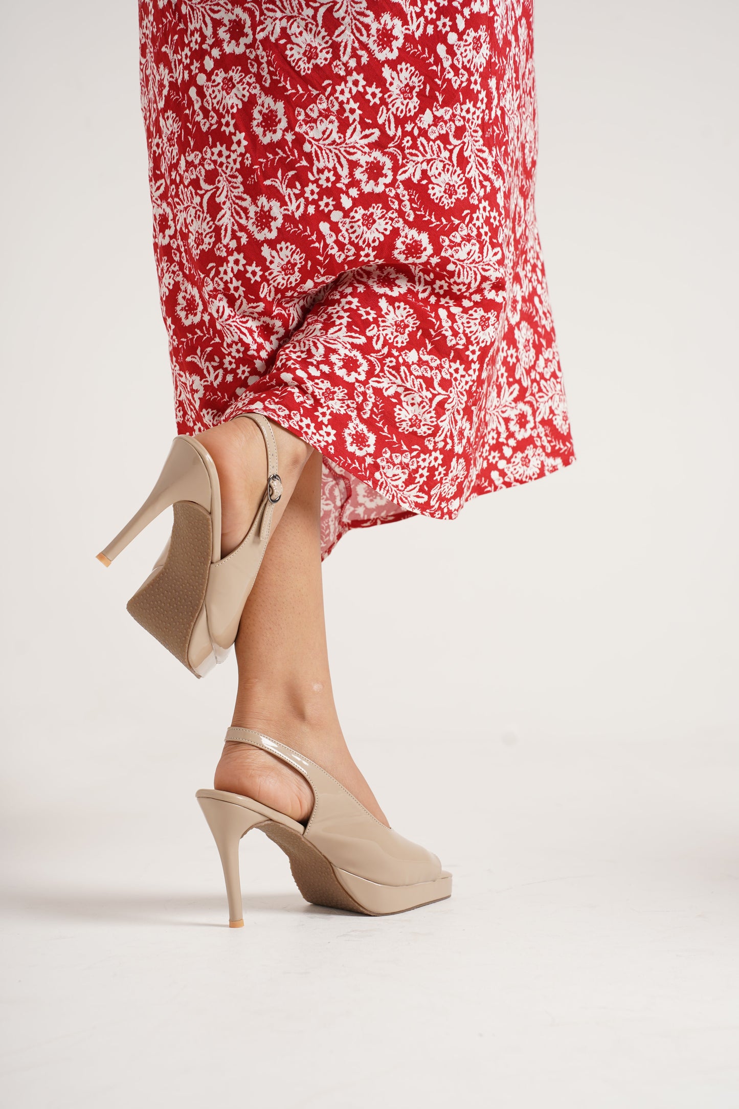Jm Looks black patent slingback heels with a high stiletto heel and platform
Cream