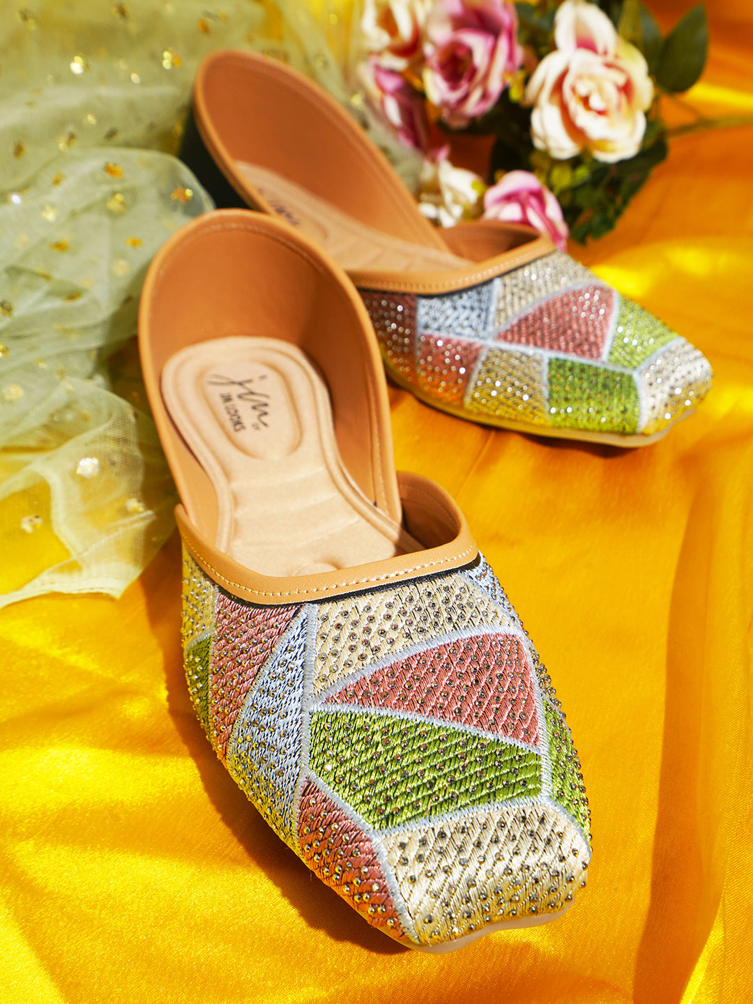 embellished juttis featuring a vibrant geometric pattern with sparkling details
Black