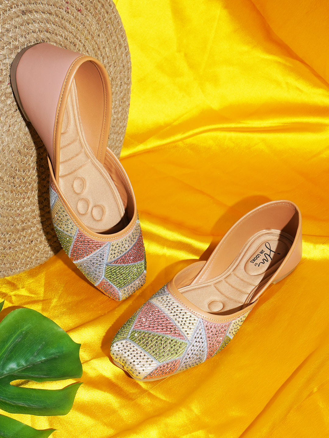 embellished juttis featuring a vibrant geometric pattern with sparkling details
Peach