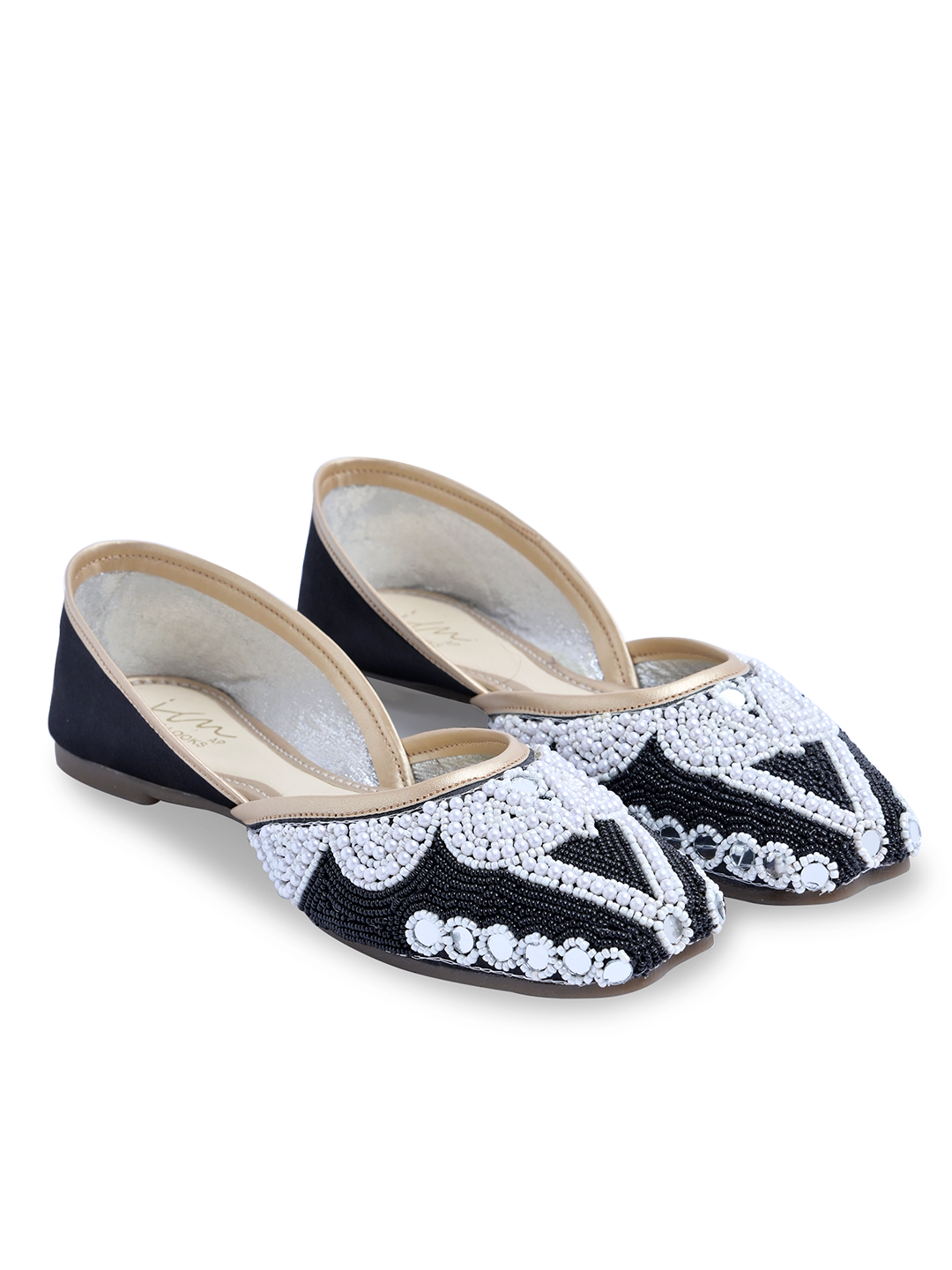 traditional juttis heavily embellished with pearls and beads on the upper
Black