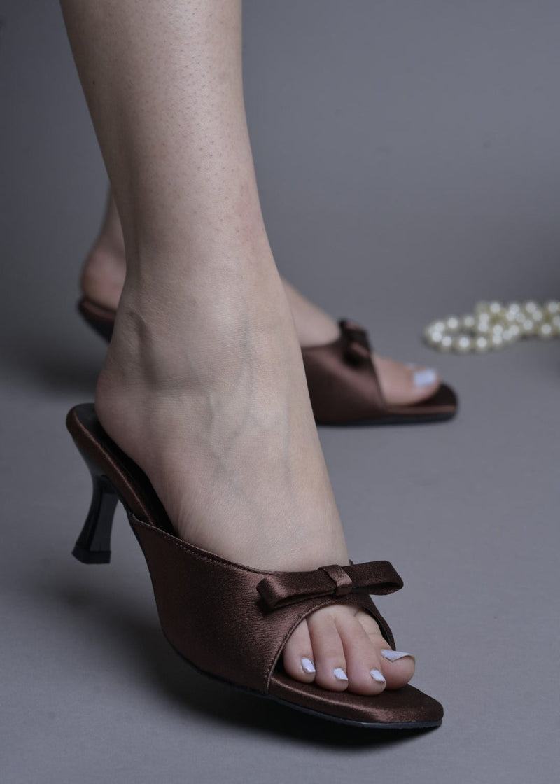 JM Looks heeled mules featuring a small bow detail on the vamp and a sculpted heel
 Copper