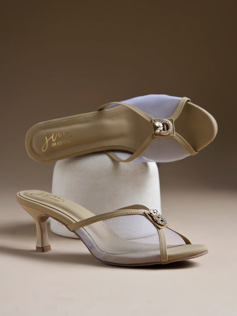 mesh kitten heel mules with an embellishment on the front
Beige