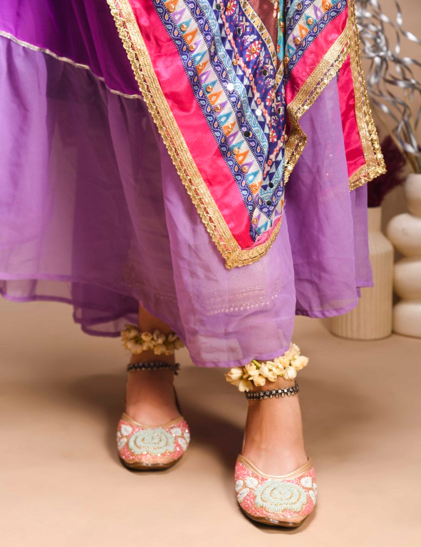 exquisitely beaded juttis featuring a floral design with intricate patterns
Peach