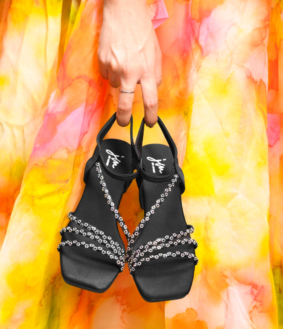 Jm Looks block heels featuring shimmering multi-straps and an elasticated ankle strap
Black
