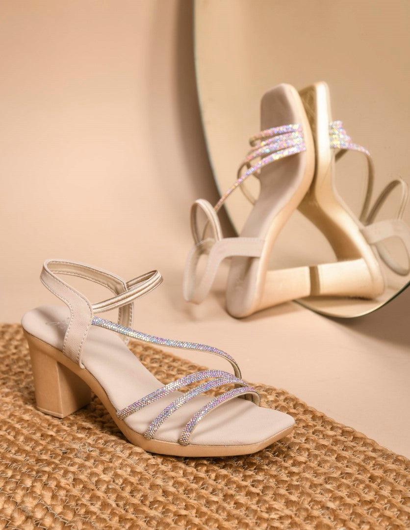 Jm Looks block heels featuring shimmering multi-straps and an elasticated ankle strap
Golden