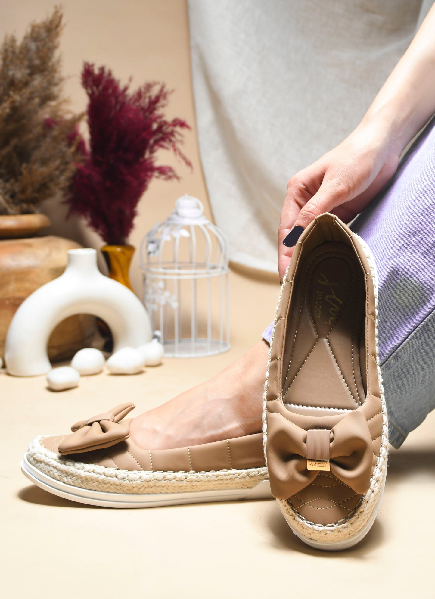 JM Looks espadrille loafers featuring a prominent bow and woven sole detail
Toupe