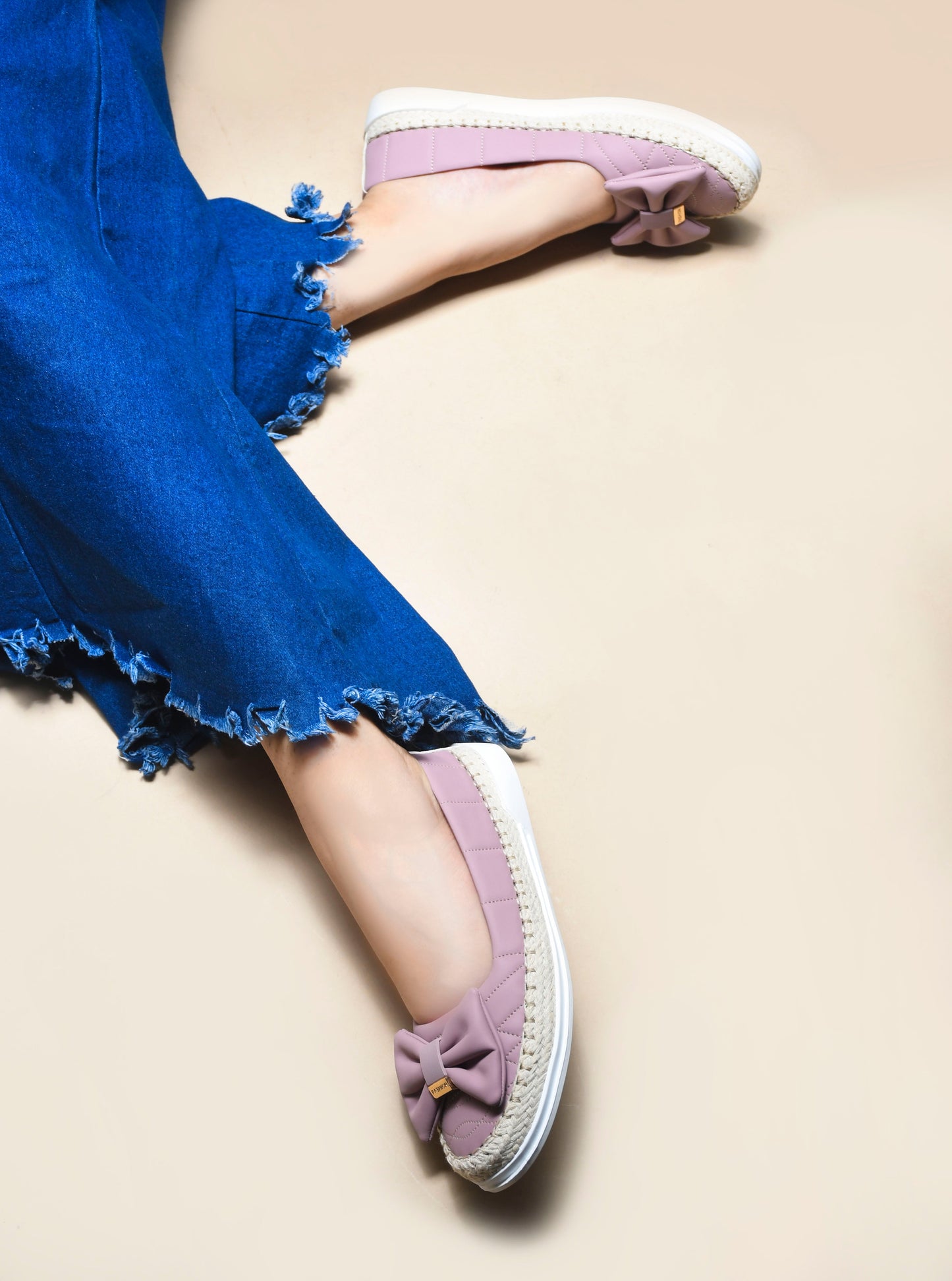 JM Looks espadrille loafers featuring a prominent bow and woven sole detail
Black