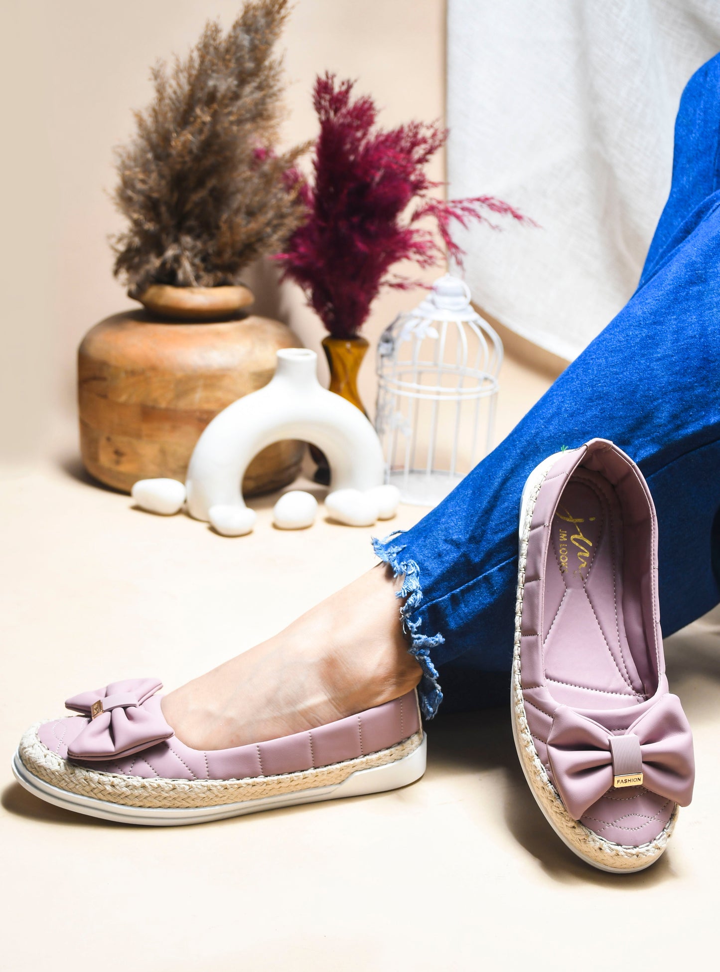 JM Looks espadrille loafers featuring a prominent bow and woven sole detail
Black