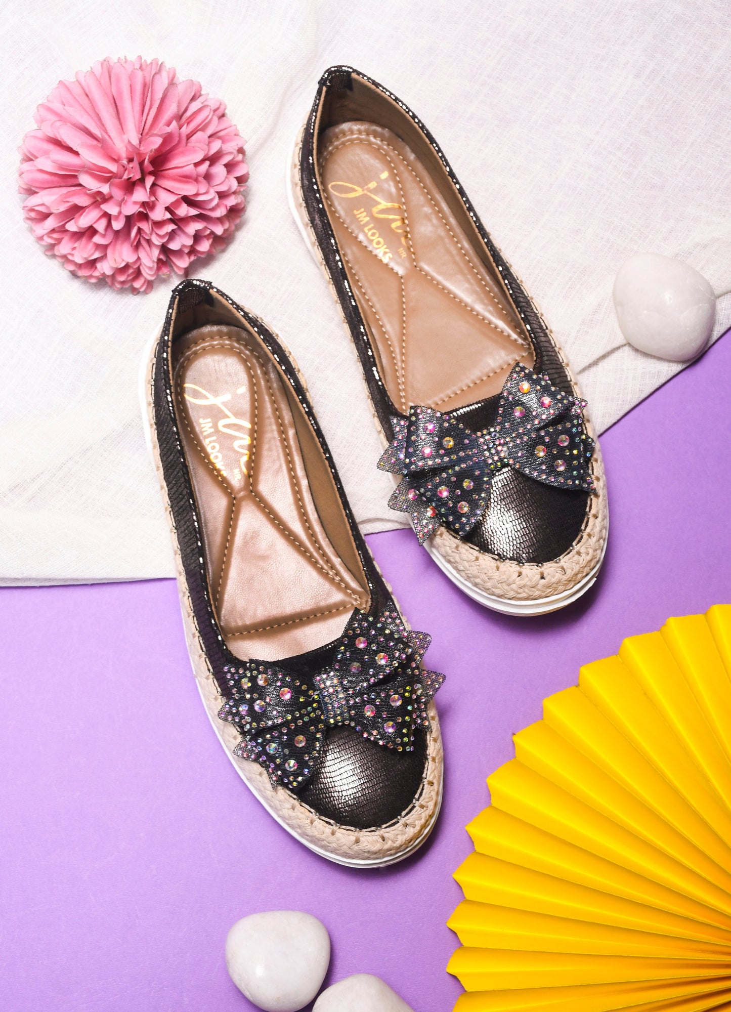 JM Looks espadrille loafers featuring a shimmering toe, a rhinestone-embellished bow, and a woven sole
Grey