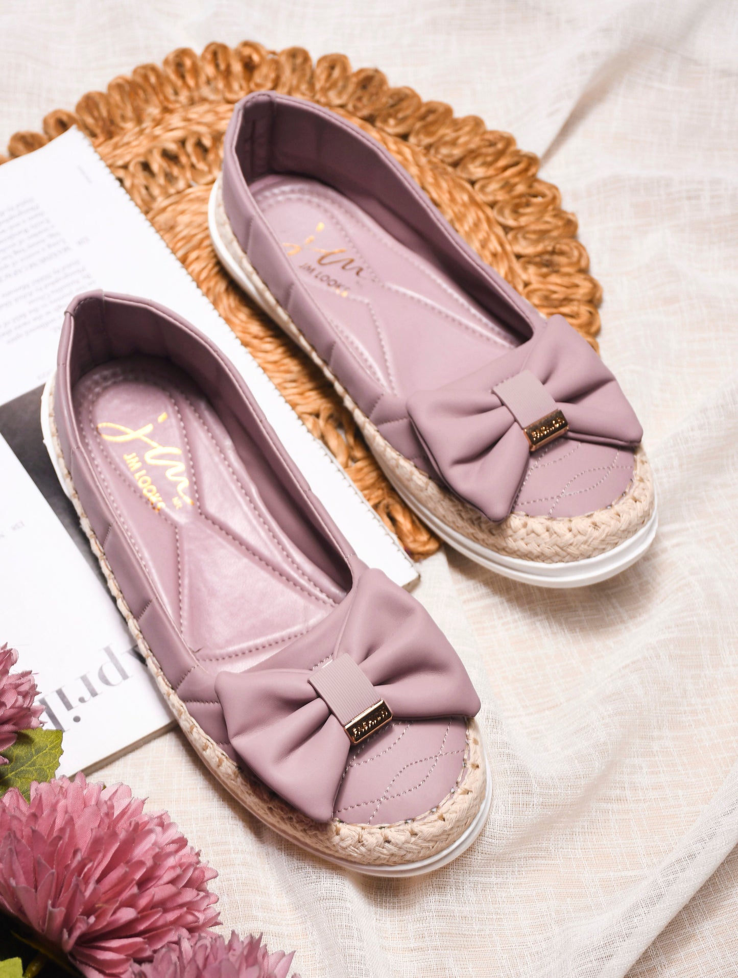JM Looks espadrille loafers featuring a prominent bow and woven sole detail
Black