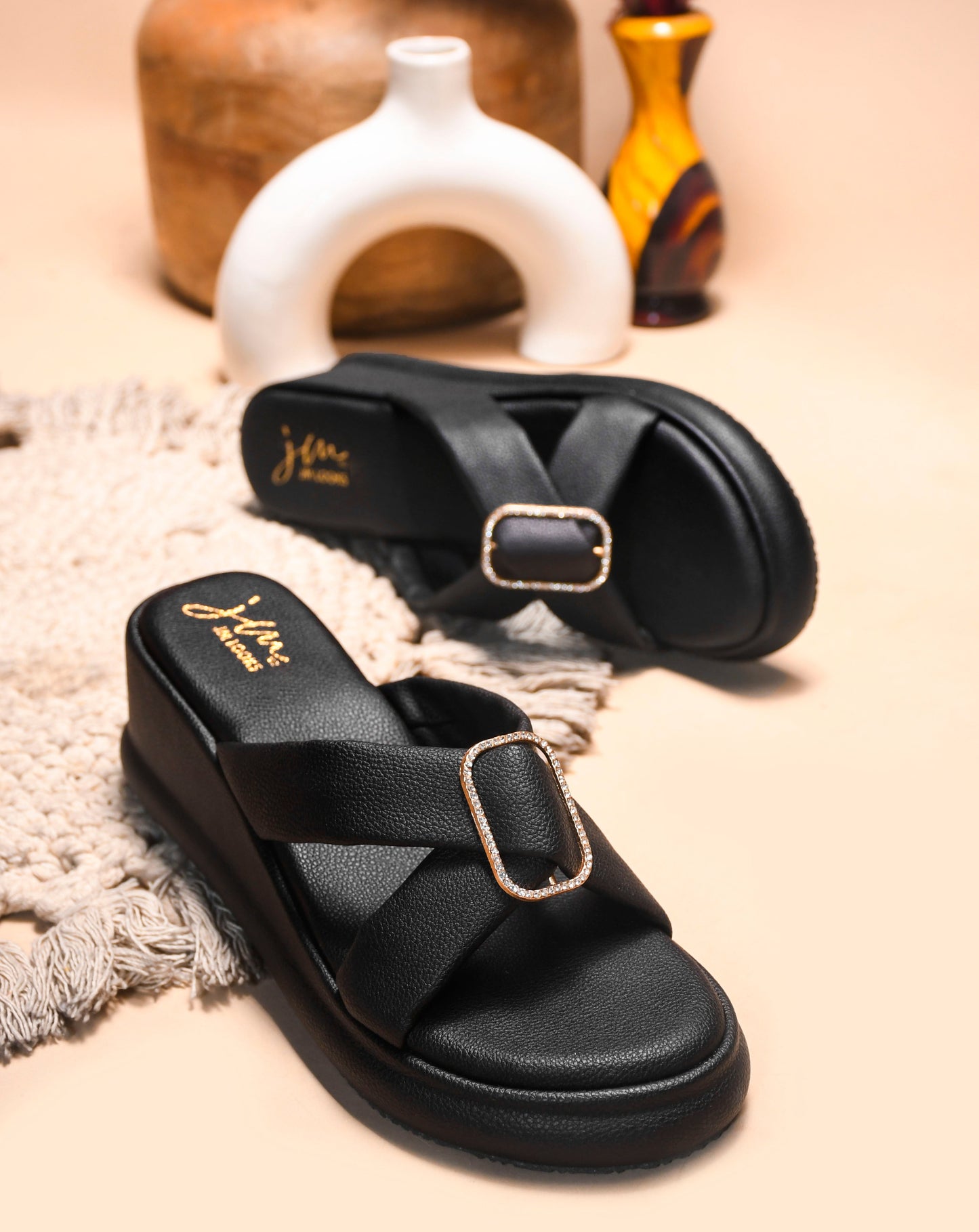 JM Looks platform wedge slides featuring wide criss-cross straps and an embellished rectangular buckle
Black