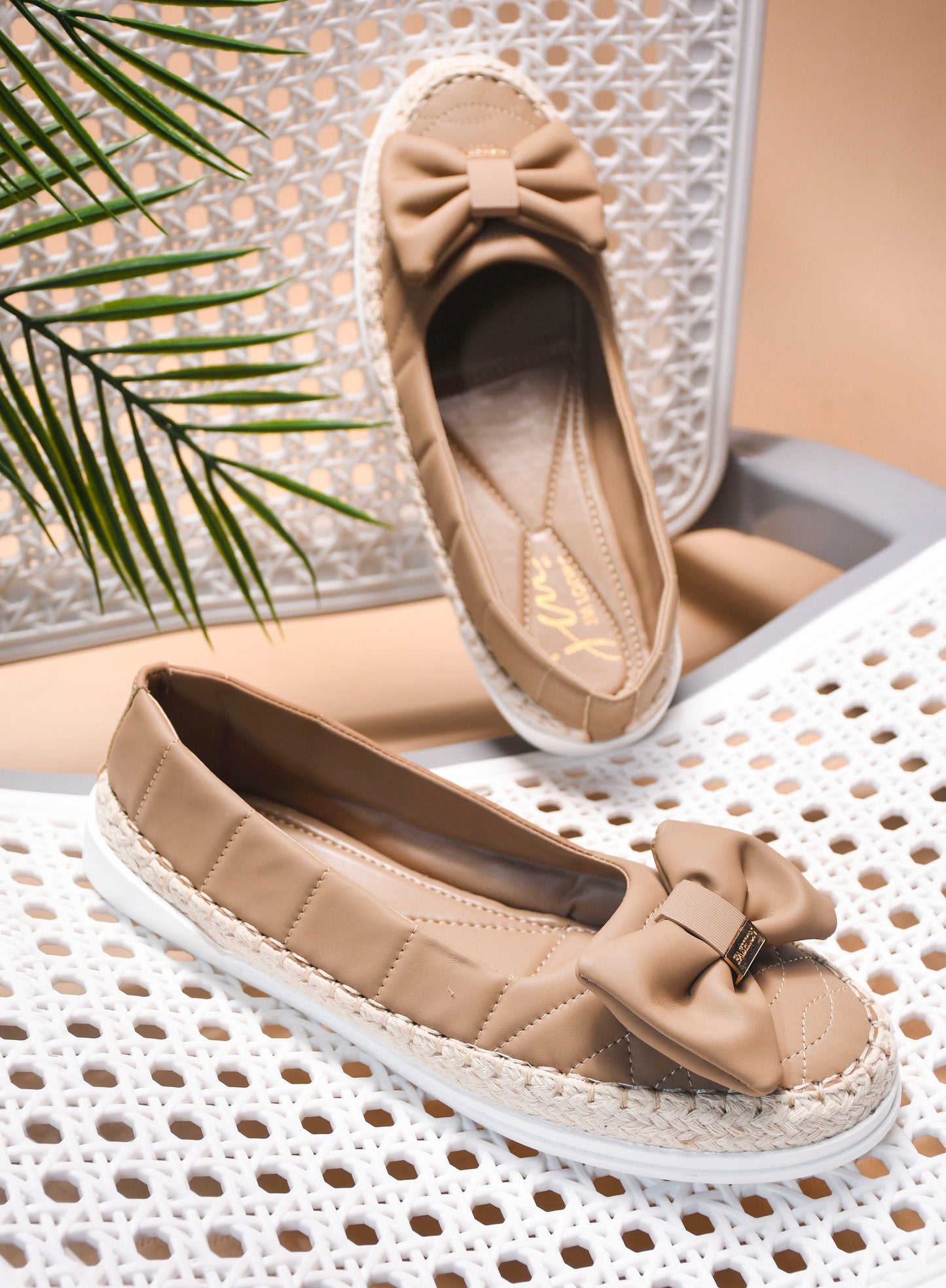 JM Looks espadrille loafers featuring a prominent bow and woven sole detail
Toupe