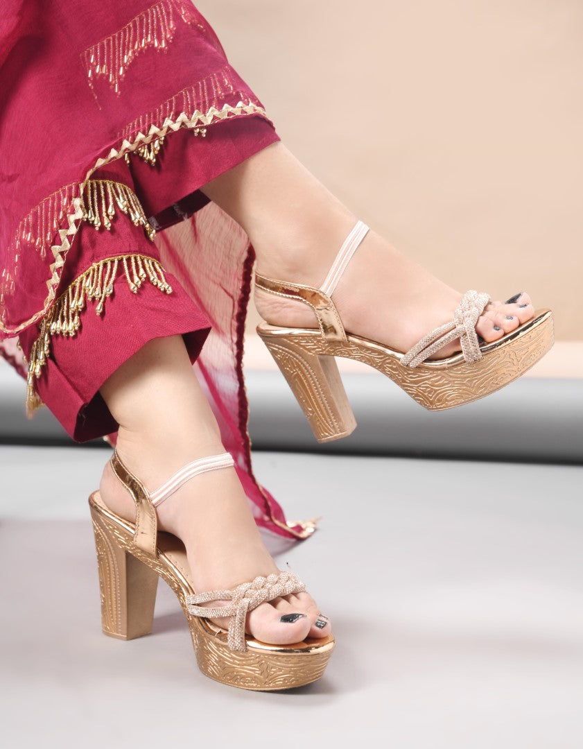 Jm Looks platform heels with braided straps and an ankle strap, paired with traditional attire
Sultan