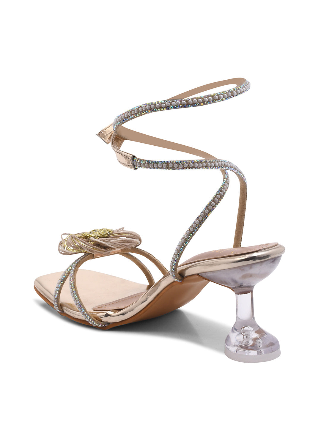 Jm Looks stiletto heels with a floral embellishment on the front and shimmering ankle-wrap straps
Golden