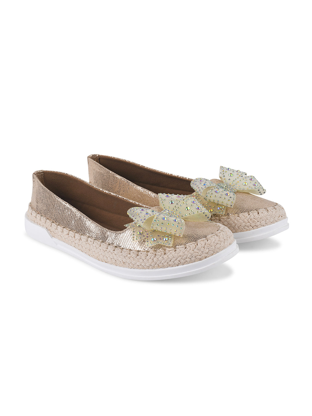JM Looks espadrille loafers featuring a shimmering toe, a rhinestone-embellished bow, and a woven sole
Golden