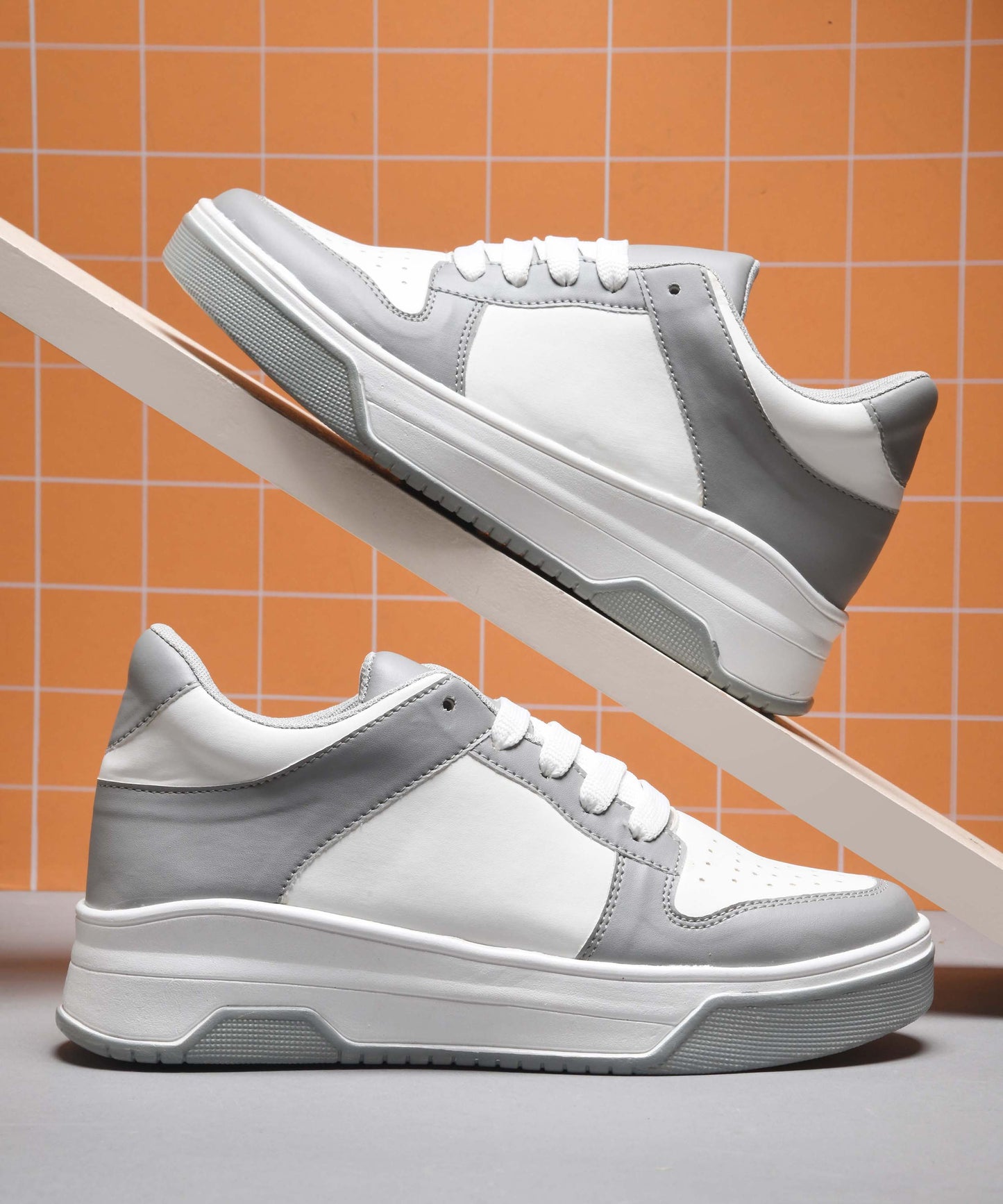 platform lace-up sneakers with a two-tone design and a chunky sole
 Grey