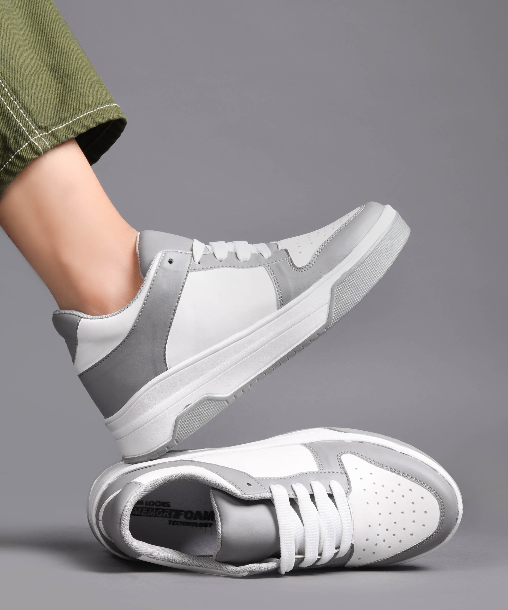 platform lace-up sneakers with a two-tone design and a chunky sole
 Grey