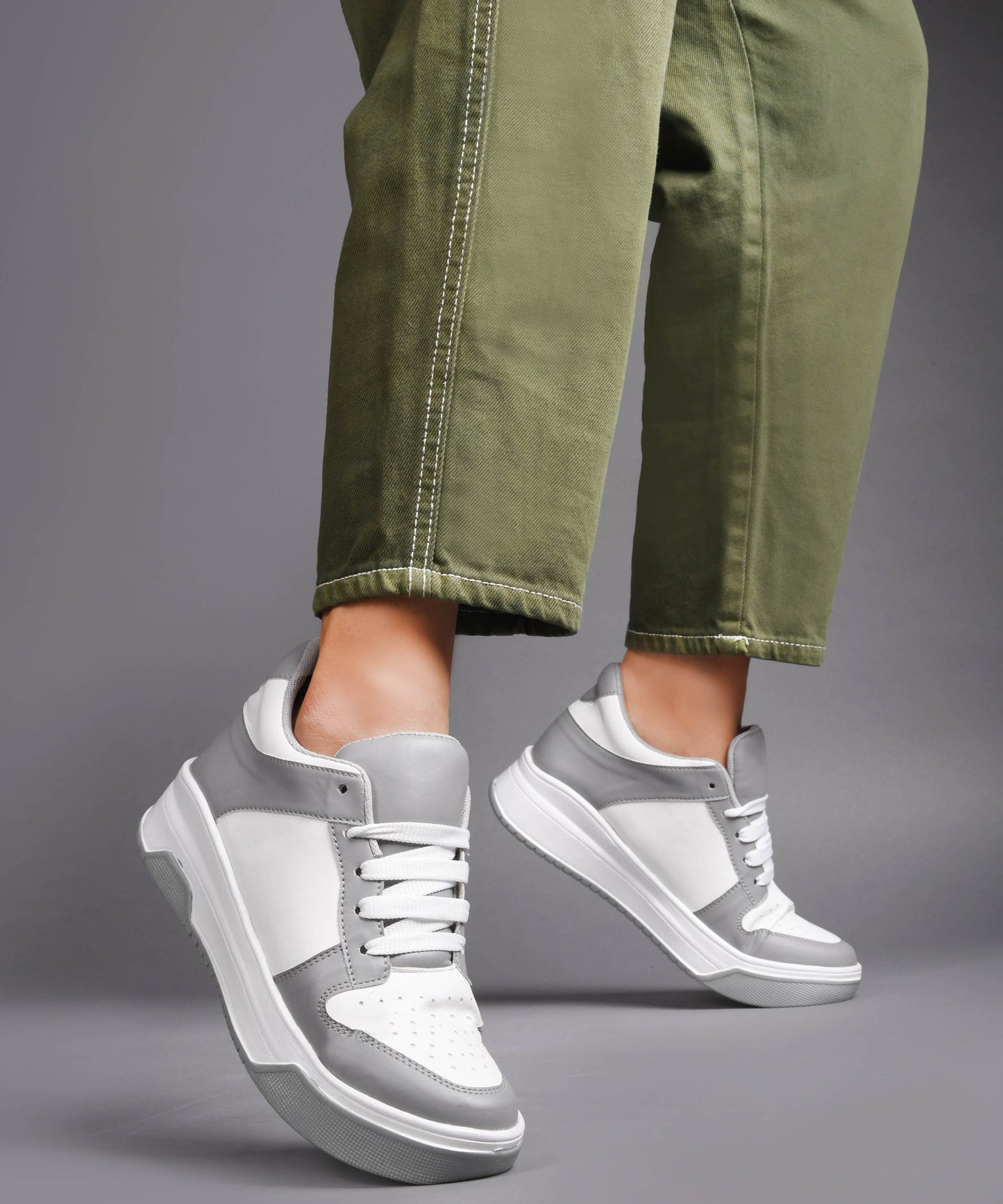 platform lace-up sneakers with a two-tone design and a chunky sole
 Grey