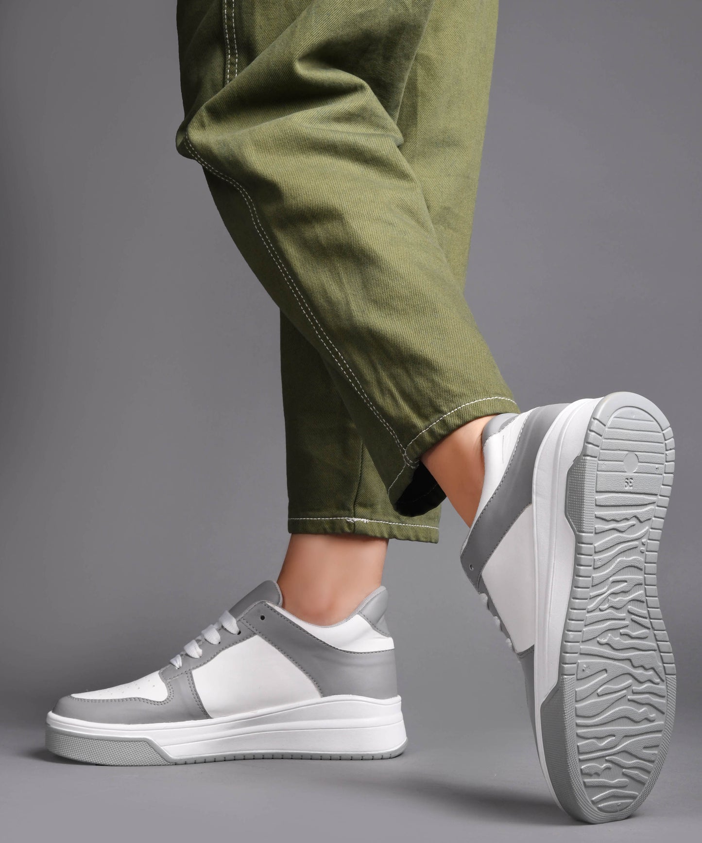 platform lace-up sneakers with a two-tone design and a chunky sole
 Grey