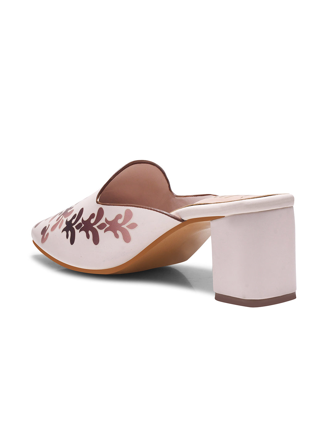 A women's mule shoe featuring a charming floral design and a block heel
Cream