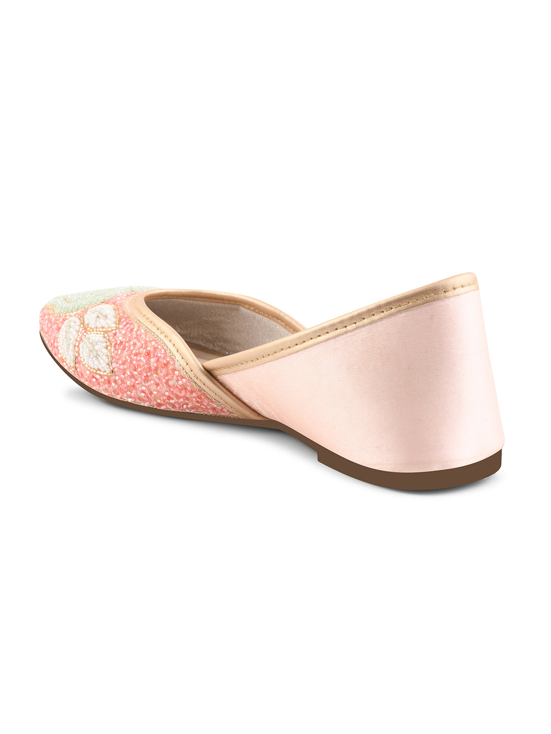 exquisitely beaded juttis featuring a floral design with intricate patterns
Peach