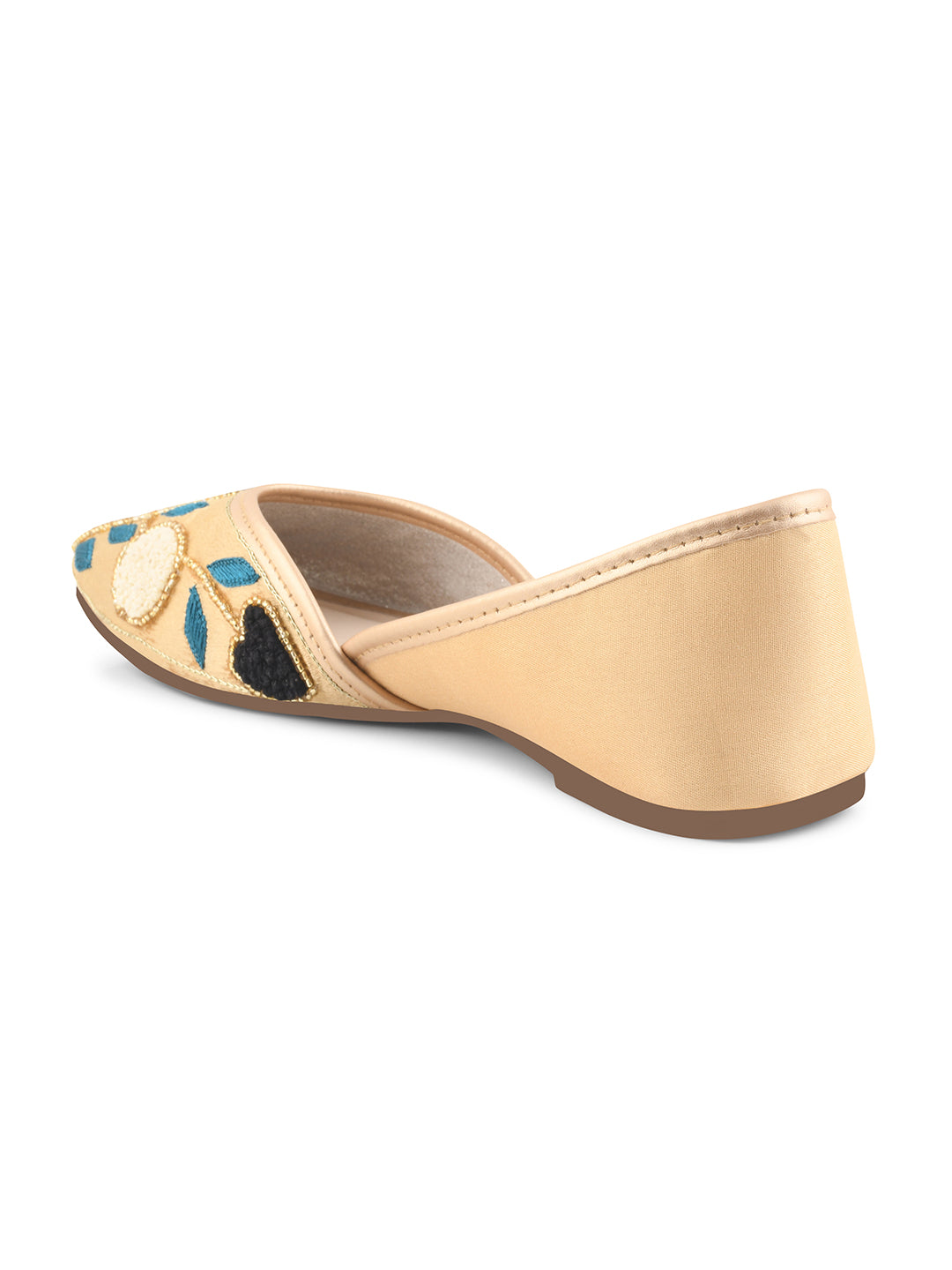 exquisitely embroidered juttis featuring floral and leaf patterns
Golden