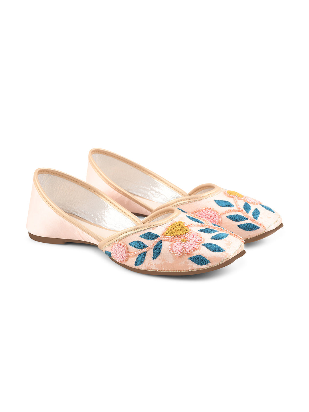 exquisitely embroidered juttis featuring floral and leaf patterns
Peach