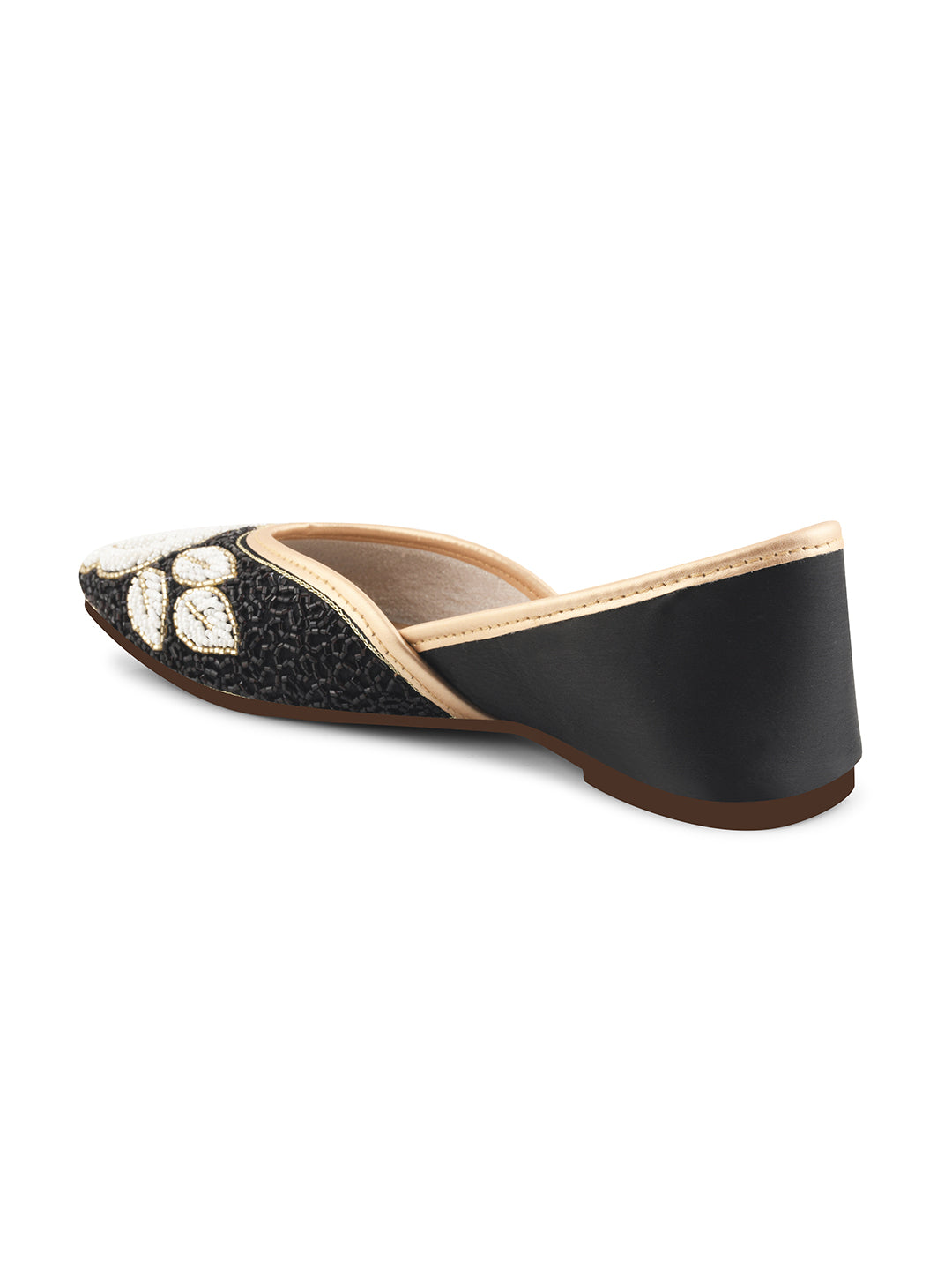 exquisitely beaded juttis featuring a floral design with intricate patterns
Black