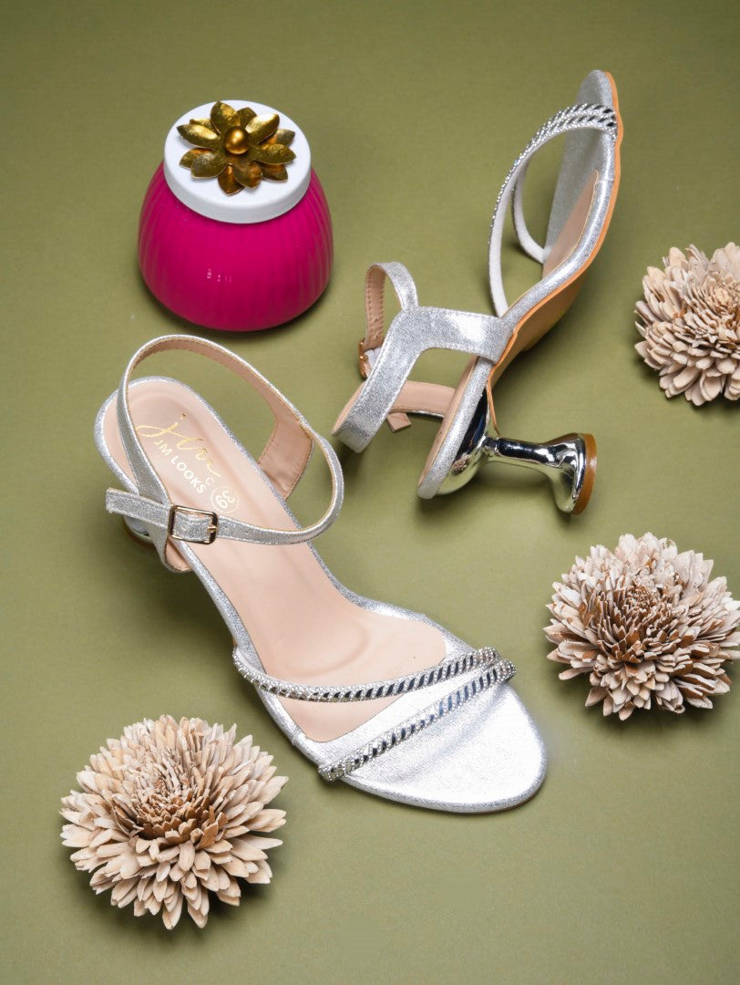 embellished strappy stiletto sandals with a unique heel design
White
