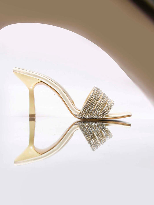 pen-toe high-heeled mules with an embellished wide strap and a contemporary square toe
 Gold