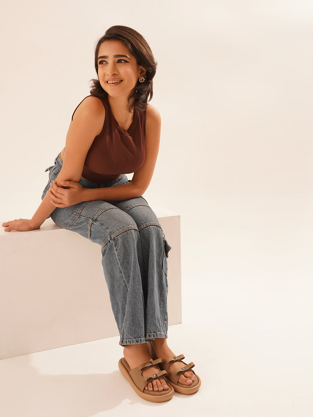 JM Looks slide sandals featuring multiple bow details on the wide straps and a flat sole
Beige