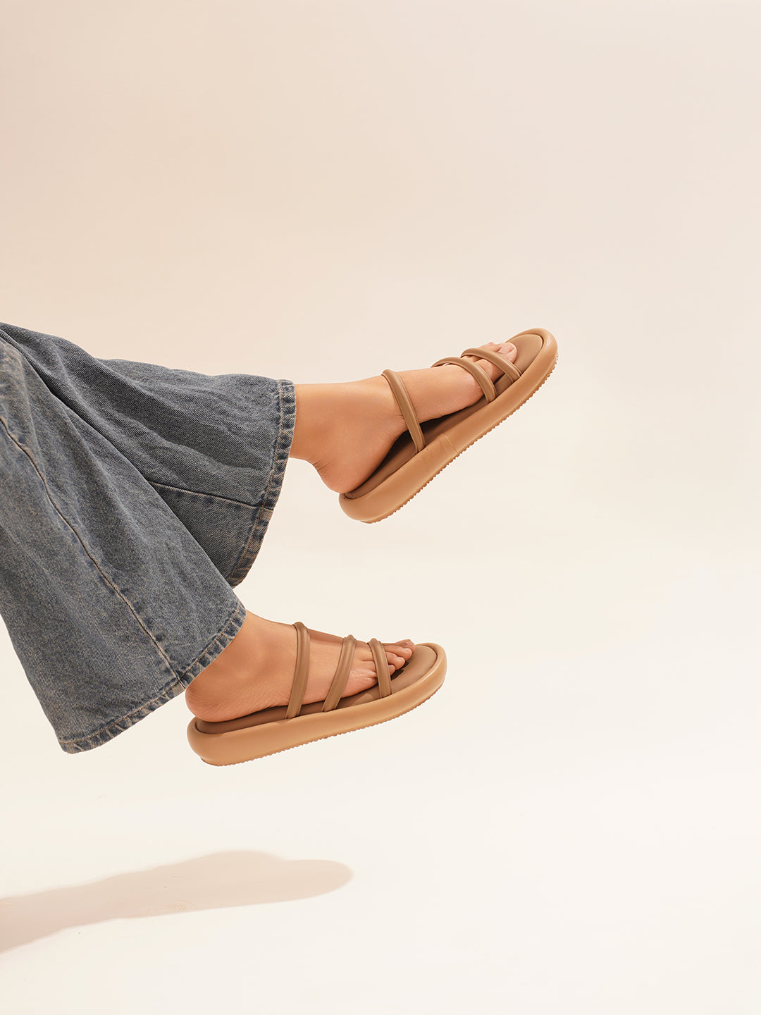 open-toe flat sandals with multiple slender straps across the forefoot
Beige