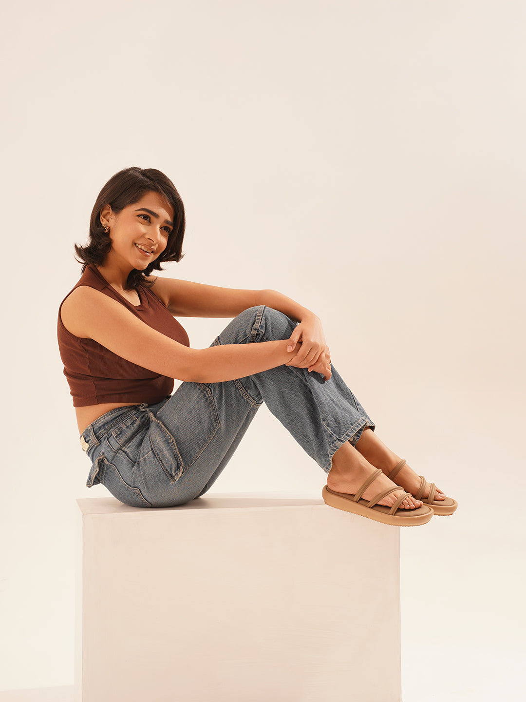 open-toe flat sandals with multiple slender straps across the forefoot
Beige