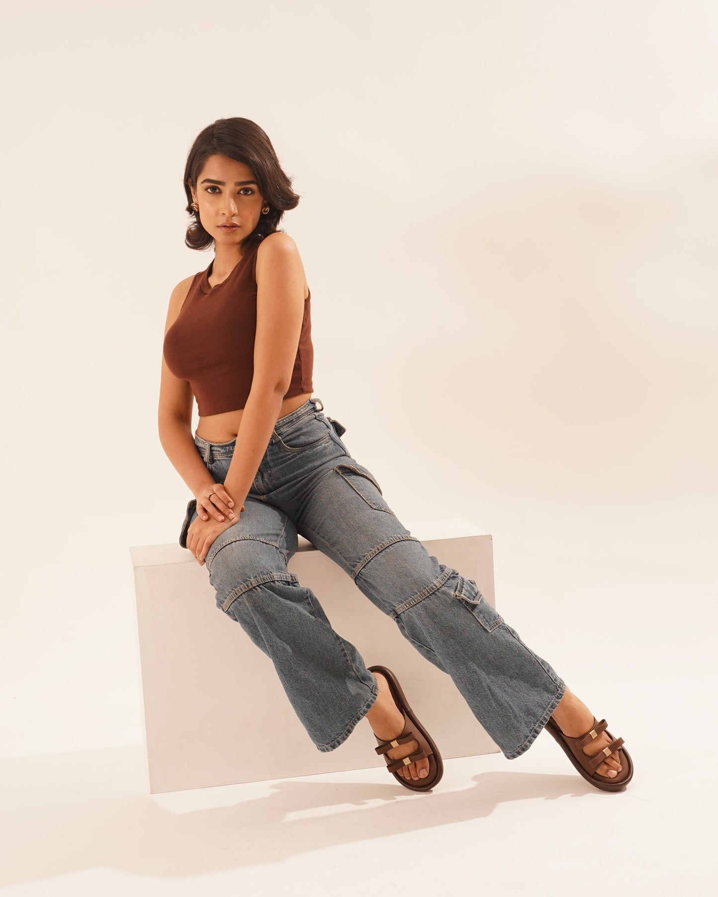JM Looks slide sandals featuring multiple bow details on the wide straps and a flat sole
Brown